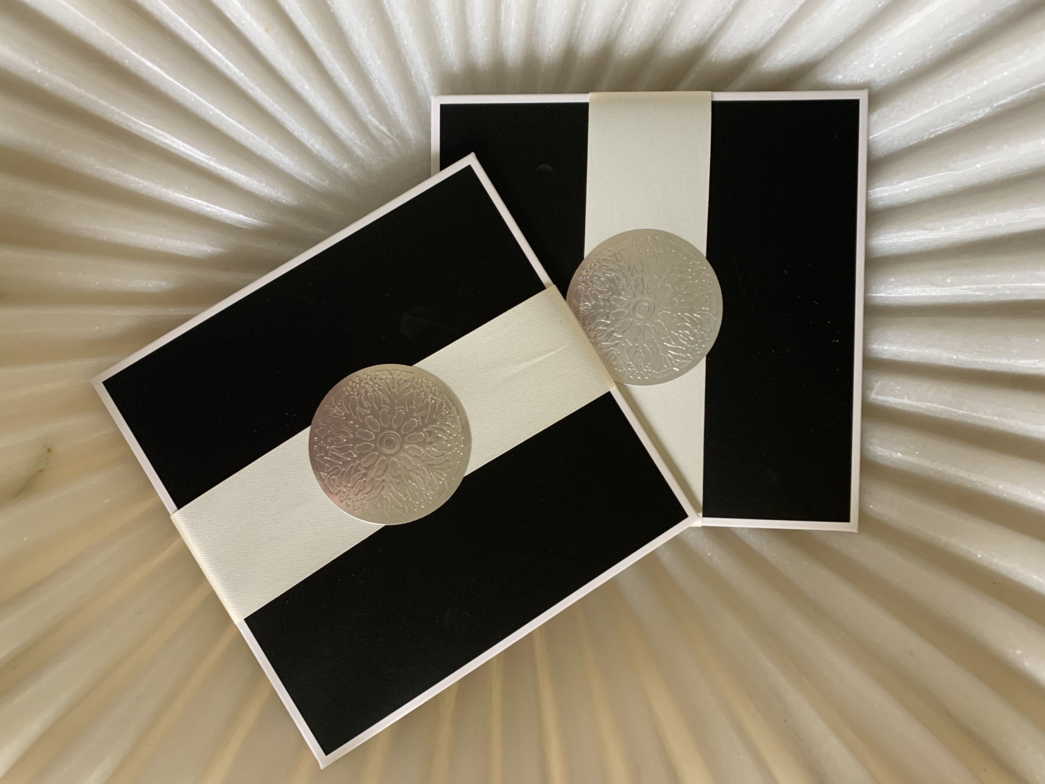 Gift cards wrapped with ribbon and seal
